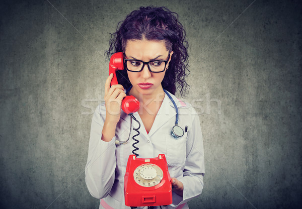 Endişeli kadın telefon beyaz tıbbi Stok fotoğraf © ichiosea