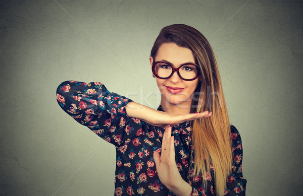 young, happy, smiling woman showing time out gesture with hands Stock photo © ichiosea