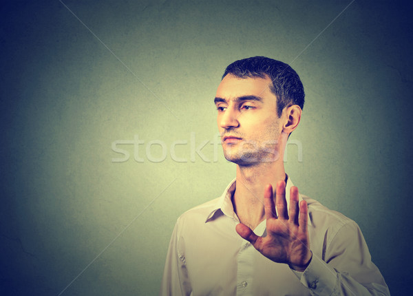 annoyed angry man with bad attitude giving talk to hand gesture Stock photo © ichiosea
