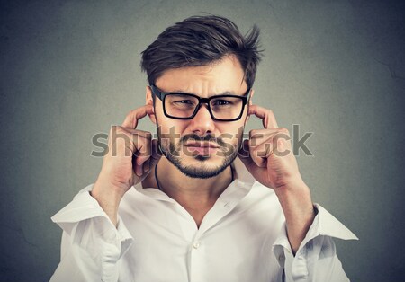 Angry mad man gesturing with finger are you crazy? Stock photo © ichiosea