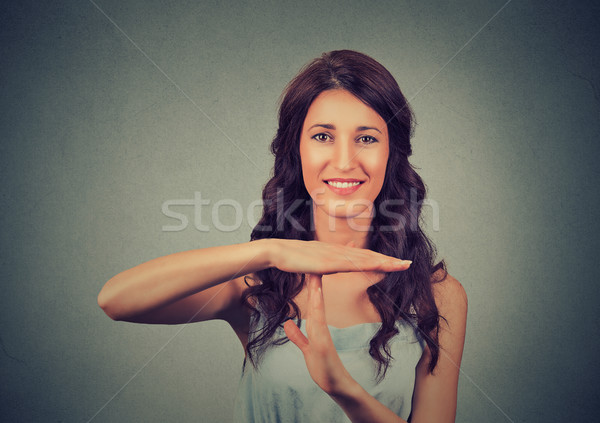young, happy, smiling woman showing time out gesture with hands  Stock photo © ichiosea