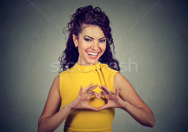 happy woman making heart sign with hands  Stock photo © ichiosea