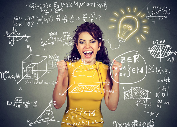 excited student with idea light bulb and maths and science formulas on blackboard Stock photo © ichiosea
