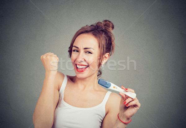 [[stock_photo]]: Excité · femme · positif · test · de · grossesse · heureux · jeune · fille