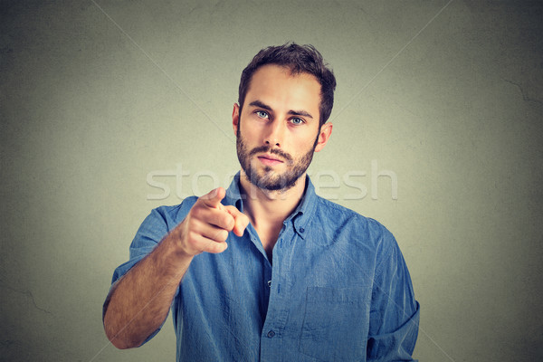 Portrait of a angry young man pointing finger at you camera gesture  Stock photo © ichiosea