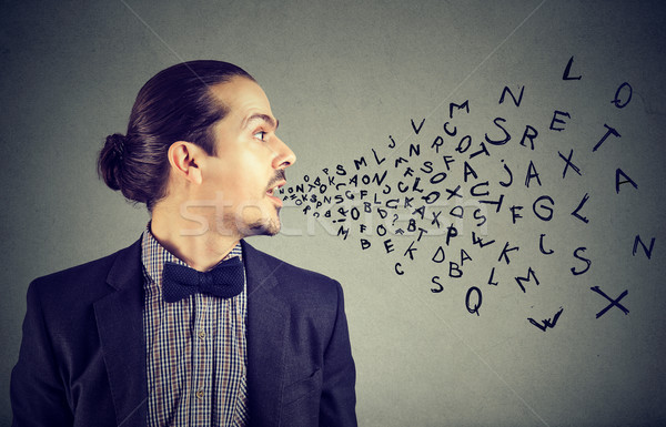 Man talking with alphabet letters coming out of his mouth. Stock photo © ichiosea