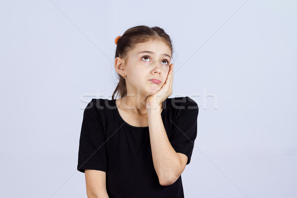 Stock photo: Sad daydreaming little girl