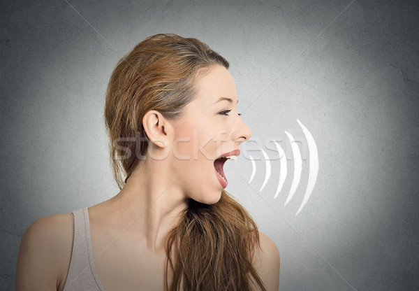 woman talking with sound waves coming out of mouth  Stock photo © ichiosea