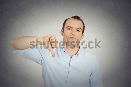 Boy Giving Thumbs Down Gesture Stock photo © ichiosea
