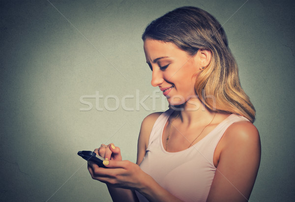 portrait woman using app on a smart phone Stock photo © ichiosea