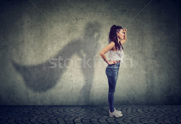Bátor nő pózol szuperhős oldalnézet néz Stock fotó © ichiosea
