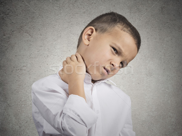 Boy with neck pain Stock photo © ichiosea