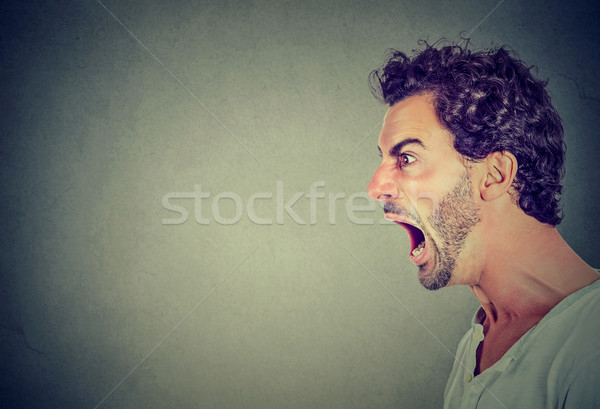 Ritratto giovani arrabbiato uomo sfondo bocca Foto d'archivio © ichiosea
