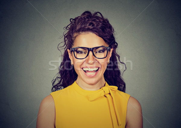 Laughing woman in yellow dress and glasses  Stock photo © ichiosea