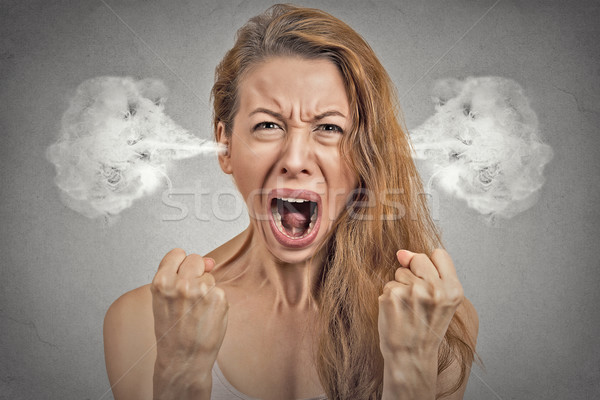  angry young woman blowing steam coming out of ears Stock photo © ichiosea