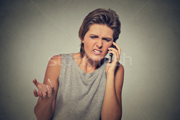 Upset skeptical, unhappy angry woman talking on phone Stock photo © ichiosea