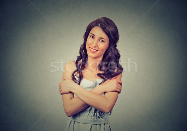 confident smiling woman holding hugging herself. Love yourself concept Stock photo © ichiosea