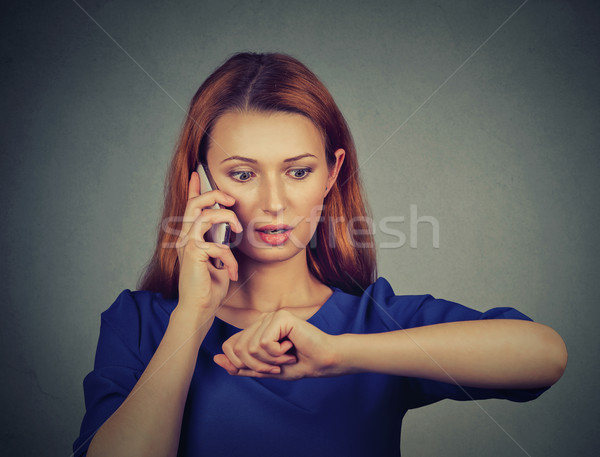 Stressed surprised business woman looking at wrist watch, running late Stock photo © ichiosea