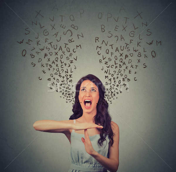 Stock photo: Young woman showing time out hand gesture, frustrated screaming
