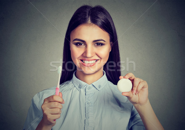 Happy woman with toothbrush and dental floss   Stock photo © ichiosea