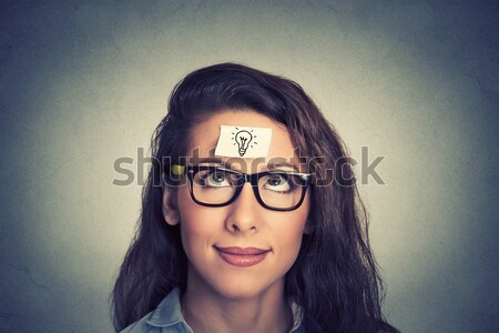 Smiling woman looking up at vintage golden key to success among many others hanging.  Stock photo © ichiosea