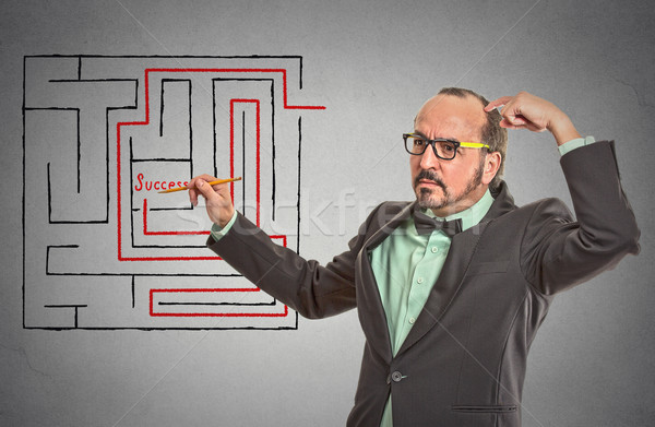 man drawing with pencil red path line through labyrinth Stock photo © ichiosea