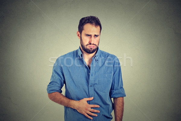 Młody człowiek żołądka ból niestrawność medycznych zdrowia Zdjęcia stock © ichiosea
