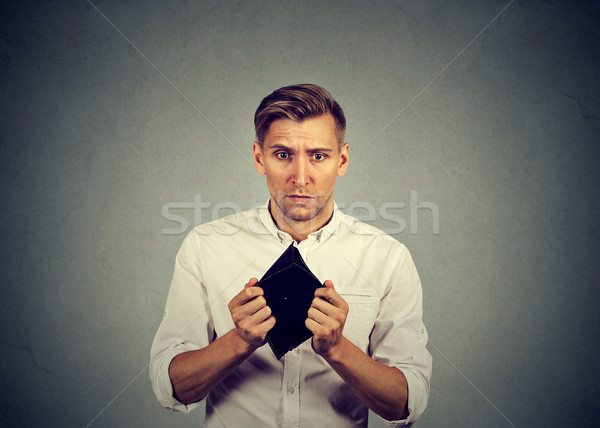 Man with no money. Businessman holding empty wallet  Stock photo © ichiosea