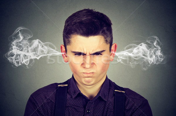 Böse junger Mann Dampf heraus Ohren Stock foto © ichiosea