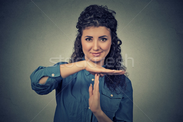young, happy, smiling woman showing time out gesture with hands Stock photo © ichiosea