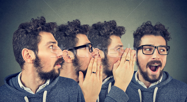 Three men whispering each other and to shocked astonished guy in the ear. Word of mouth. Stock photo © ichiosea