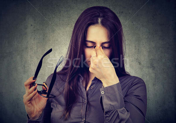Woman with glasses suffering from eyestrain Stock photo © ichiosea