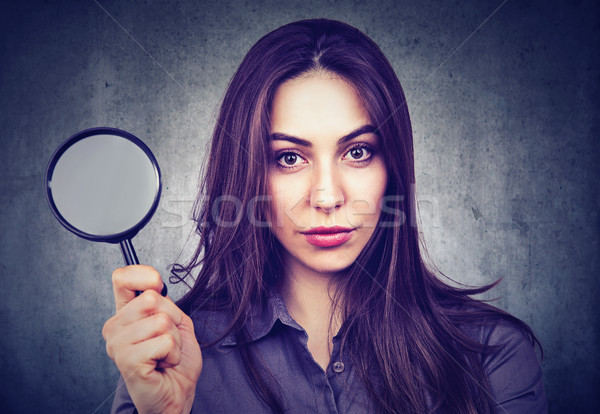 Beautiful woman with magnifying glass  Stock photo © ichiosea