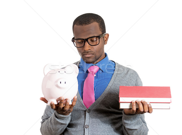 Man holding books and piggy bank Stock photo © ichiosea