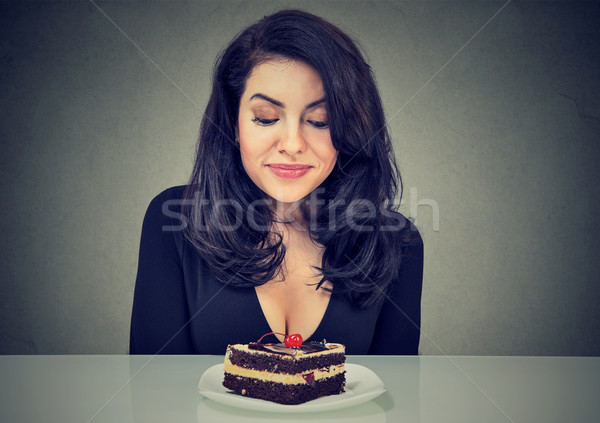 Desperate woman craving cake dessert, eager to eat Stock photo © ichiosea