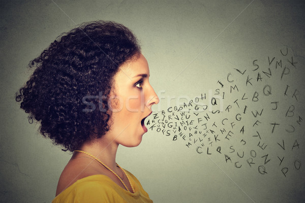 Woman talking with alphabet letters coming out of her mouth. Communication intelligence concept Stock photo © ichiosea
