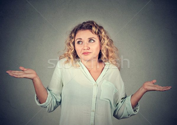 dumb looking woman arms out shrugs shoulders Stock photo © ichiosea