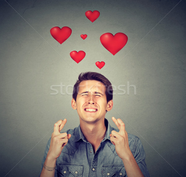 Young man in love making a wish Stock photo © ichiosea