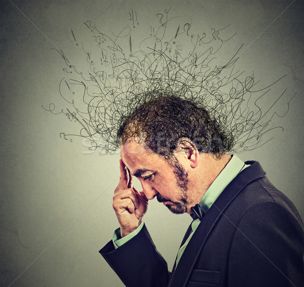 worried man with worried stressed face expression and brain melting into lines  Stock photo © ichiosea