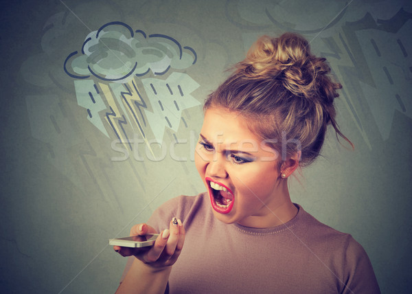 Portrait angry young woman screaming on mobile phone Stock photo © ichiosea