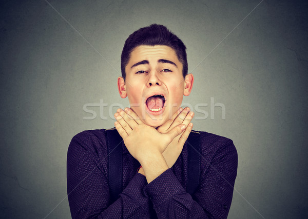 Young man having asthma attack or choking can't breath Stock photo © ichiosea