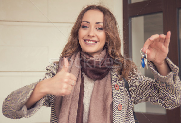 Cheerful woman showing keys from new house Stock photo © ichiosea