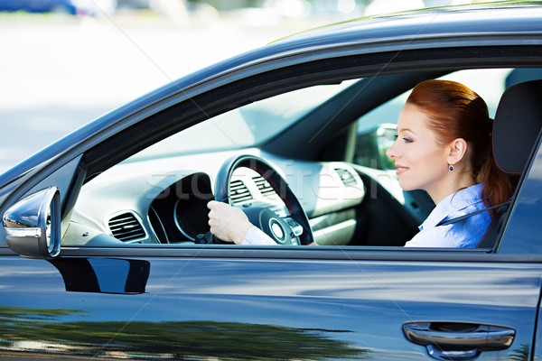 Woman driving car, follows traffic rules, precautions  Stock photo © ichiosea