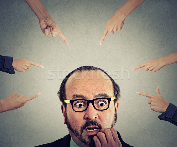 Concept social accusation of guilty businessman fingers pointing at him  Stock photo © ichiosea