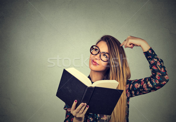 woman with glasses, holding, reading book, scratching head, looking up confused Stock photo © ichiosea