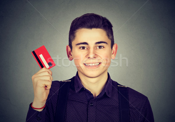 happy young man showing credit card  Stock photo © ichiosea