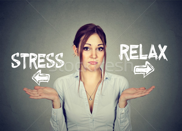Stress or relax. Confused woman shrugging shoulders doesn't know  Stock photo © ichiosea