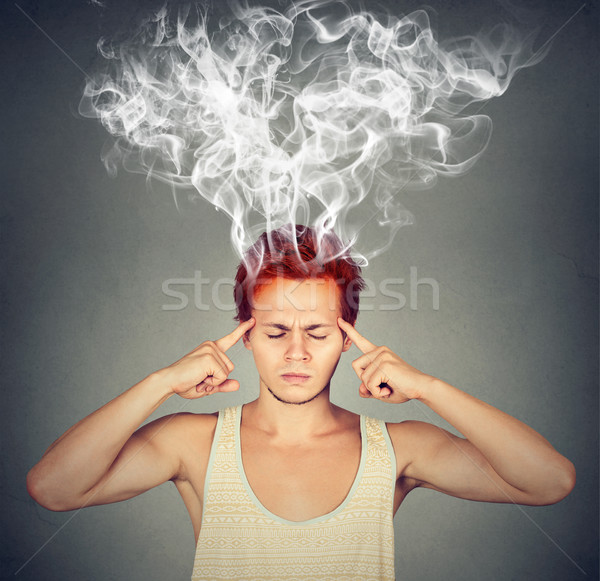 man thinks very intensely having headache  Stock photo © ichiosea