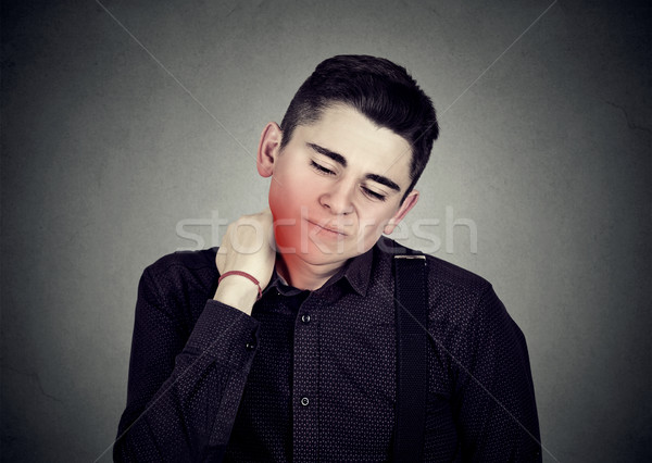 Man with neck pain colored in red  Stock photo © ichiosea