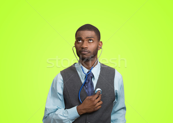 Executive man listening  to his heart, self criticism concept Stock photo © ichiosea